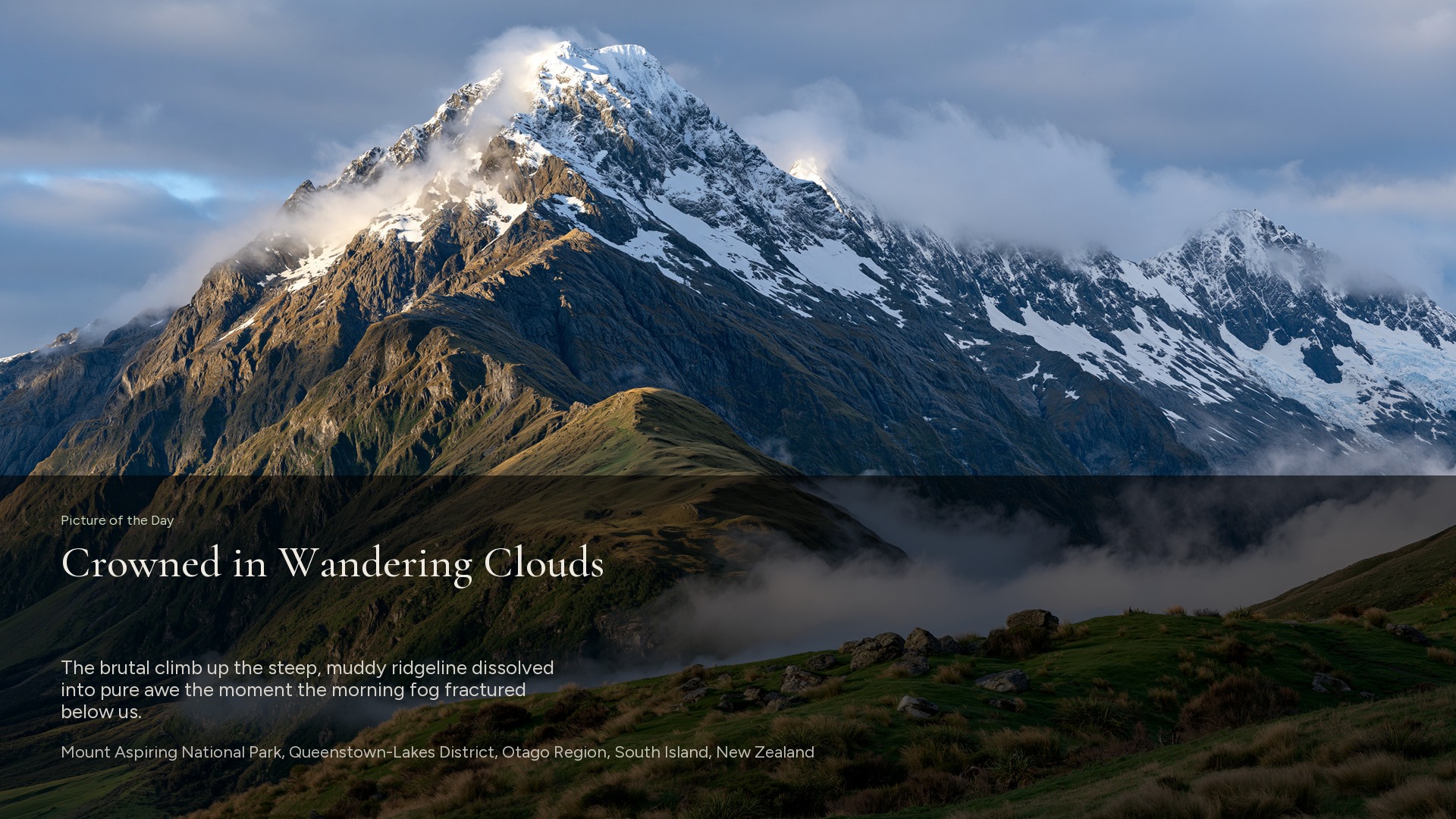 Screensaver cover on a sunlit mountain, titled Crowned in Wandering Clouds, Mount Aspiring National Park, New Zealand.